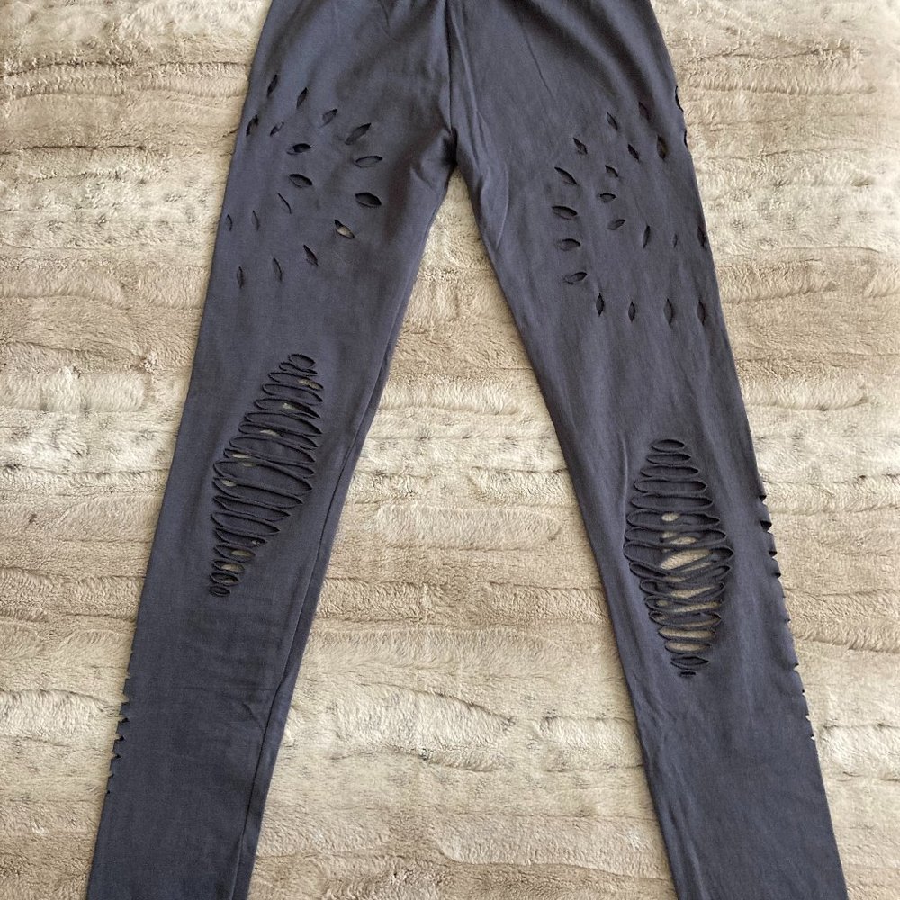 Small NWOT Grey Yoga Leggings with cut-out details.